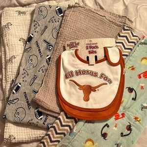 3 swaddles, 2 bibs and 2 burp clothes.